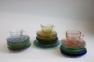 Multi-colored stacks of depression glass plate patterns